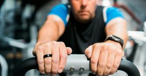 Man over 40 training in gym — managing andropause symptoms through exercise